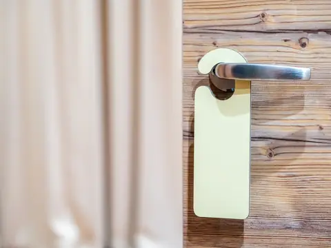 A blank door hanger on a door handle